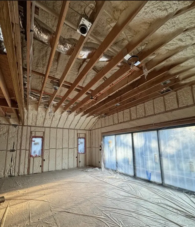 Interior walls and ceiling insulated with spray foam during new construction in Coachella